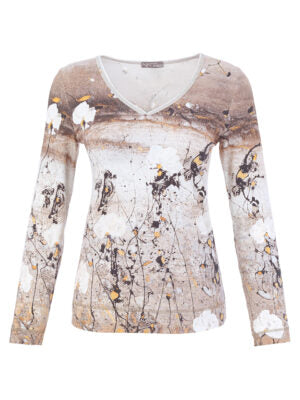 A women's long-sleeve V-neck knit top featuring an abstract, painterly print in beige, brown, white, and black with small yellow accents, shown against a plain white background.