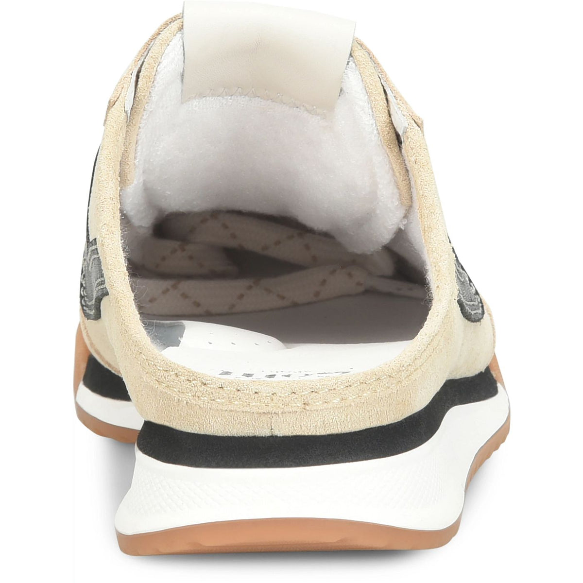A close-up rear view of a slip-on sneaker with a beige suede upper, white plush lining, a black stripe, and a white and gum sole.