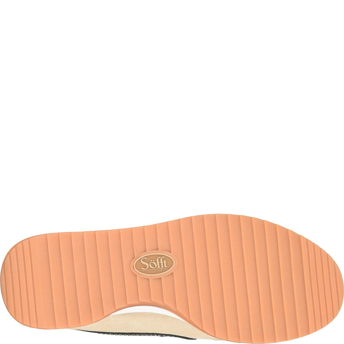 A close-up of a shoe's sole showing a peach-colored ribbed rubber bottom with a central oval logo that reads 'Soft'.